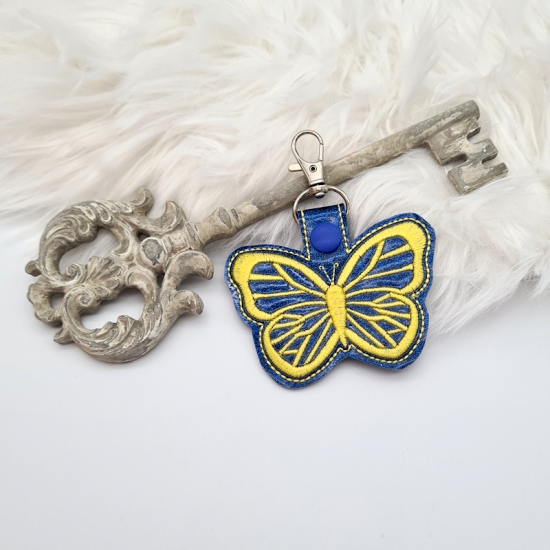 Taschenanhänger / Taschenbaumler Schmetterling blau/gelb